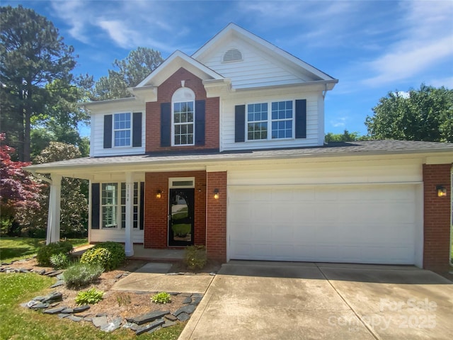 1184 Lempster Dr NW, Concord, NC 28027 - view of front of property featuring covered porch, brick siding, concrete driveway, and an attached garage