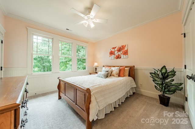 157 Dedham Loop, Mooresville, NC 28117 - bedroom featuring light carpet, wainscoting, ornamental molding, and ceiling fan