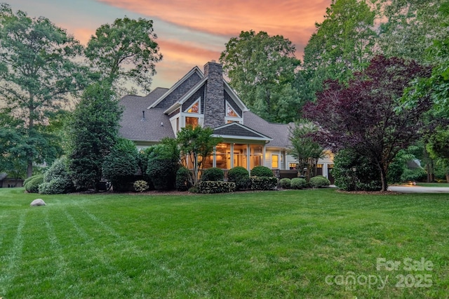 157 Dedham Loop, Mooresville, NC 28117 - view of front of home with a chimney and a front lawn