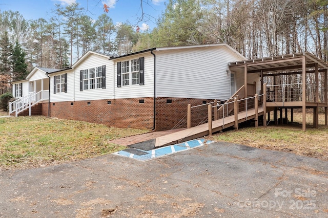 1370 Poole Rd, Salisbury, NC 28146 - back of house featuring crawl space, a lawn, and stairway