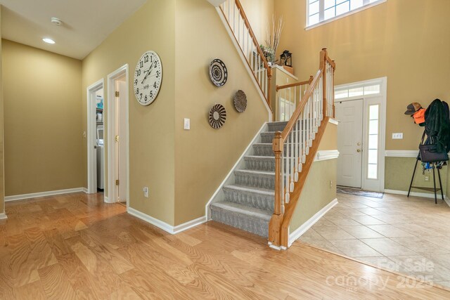 5656 Cambridge Bay Dr, Charlotte, NC 28269 - stairway featuring healthy amount of natural light, baseboards, and a high ceiling