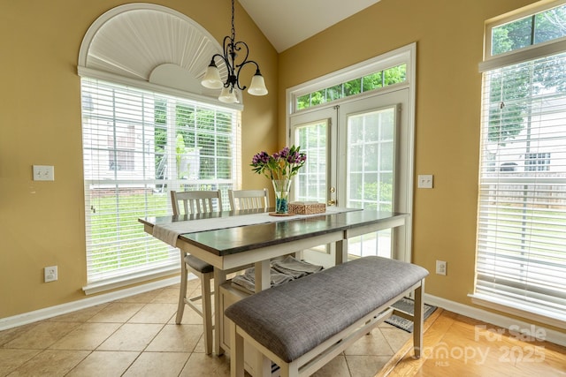 5656 Cambridge Bay Dr, Charlotte, NC 28269 - dining space with a chandelier, baseboards, and lofted ceiling