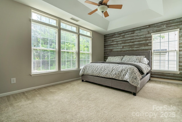 5656 Cambridge Bay Dr, Charlotte, NC 28269 - bedroom with multiple windows, baseboards, carpet floors, and a tray ceiling