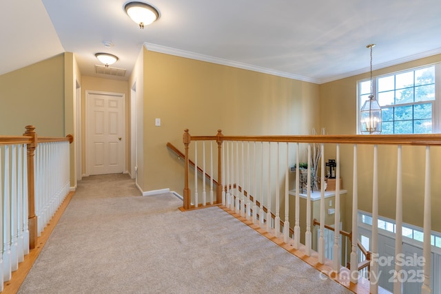 5656 Cambridge Bay Dr, Charlotte, NC 28269 - corridor with an upstairs landing, carpet flooring, baseboards, ornamental molding, and a chandelier