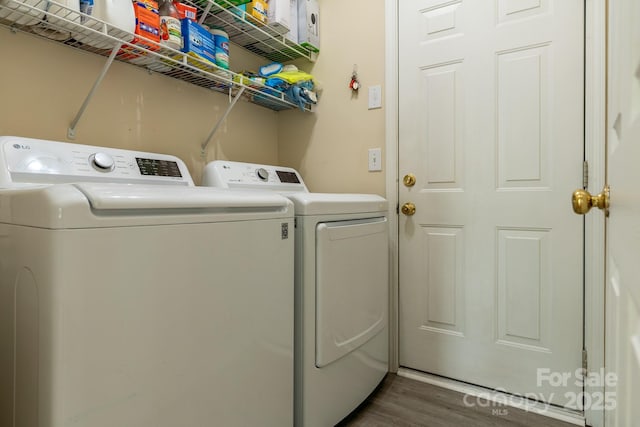 5656 Cambridge Bay Dr, Charlotte, NC 28269 - laundry area featuring washer and clothes dryer and dark wood-type flooring