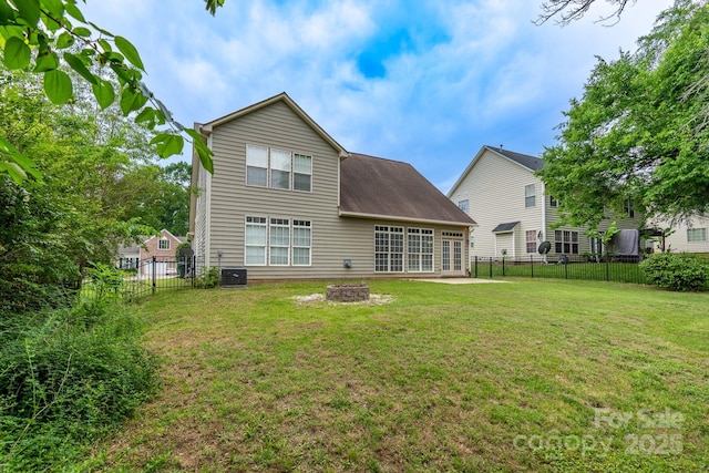 5656 Cambridge Bay Dr, Charlotte, NC 28269 - back of property with an outdoor fire pit and central AC