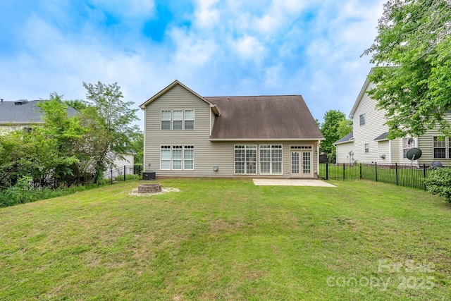 5656 Cambridge Bay Dr, Charlotte, NC 28269 - back of property with an outdoor fire pit, french doors, and a patio