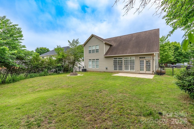 5656 Cambridge Bay Dr, Charlotte, NC 28269 - rear view of house with a patio area, a fire pit, and french doors