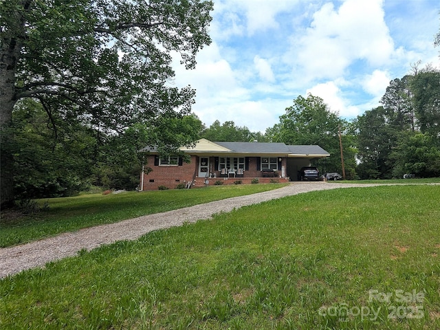 3116 Pilgrim Rd, Chester, SC 29706 - ranch-style home featuring driveway, crawl space, brick siding, a front lawn, and a carport