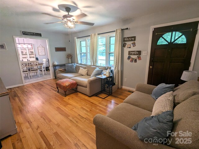 3116 Pilgrim Rd, Chester, SC 29706 - living room with a ceiling fan, wood finished floors, and baseboards