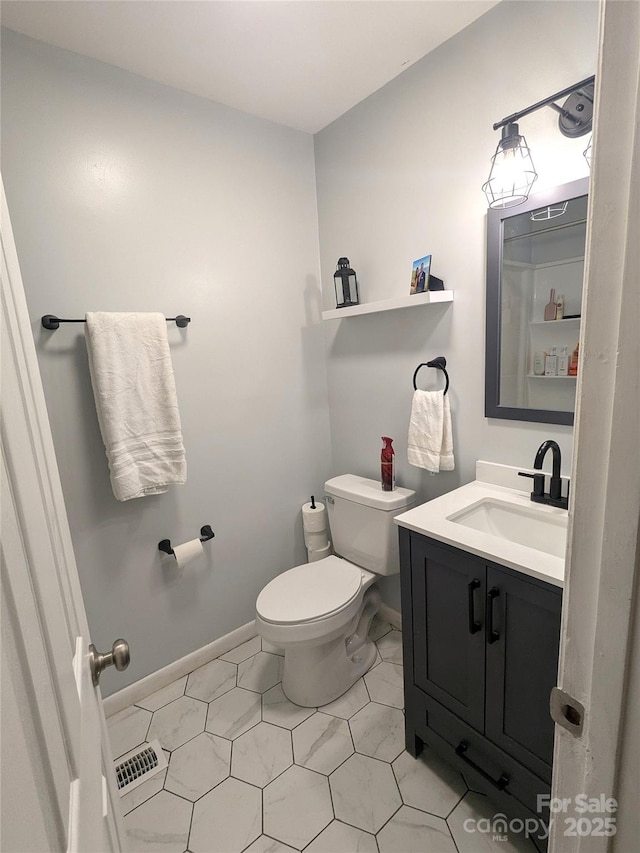 3116 Pilgrim Rd, Chester, SC 29706 - bathroom featuring vanity, toilet, and baseboards