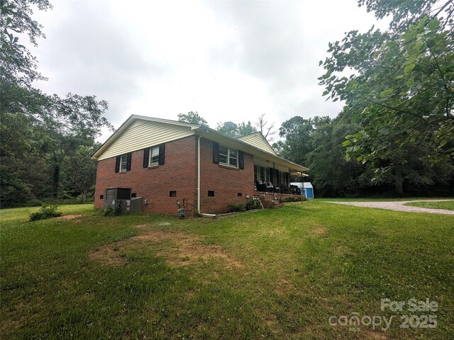 3116 Pilgrim Rd, Chester, SC 29706 - view of side of property with brick siding, a lawn, and crawl space
