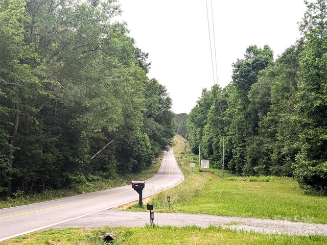 3116 Pilgrim Rd, Chester, SC 29706 - view of asphalt road featuring a wooded view
