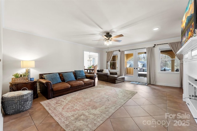 148 Fairway Dr, Forest City, NC 28043 - living room with tile patterned flooring, ceiling fan, ornamental molding, recessed lighting, and french doors