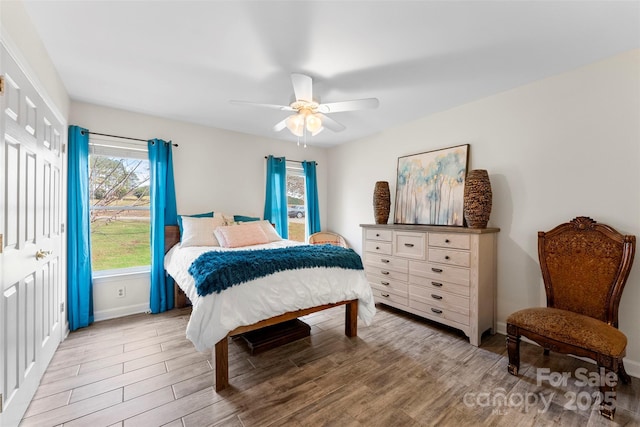 148 Fairway Dr, Forest City, NC 28043 - bedroom featuring light wood-style floors, baseboards, ceiling fan, and a closet