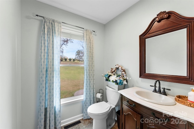 148 Fairway Dr, Forest City, NC 28043 - bathroom with toilet, vanity, and baseboards