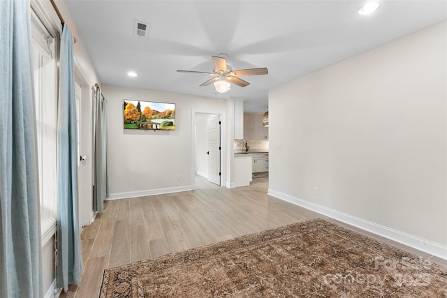 148 Fairway Dr, Forest City, NC 28043 - empty room with light wood-style floors, a ceiling fan, baseboards, and recessed lighting