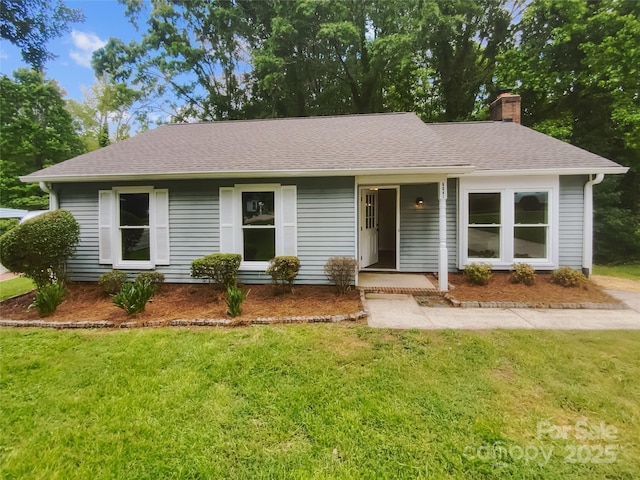 single story home with a front lawn, a chimney, and a shingled roof