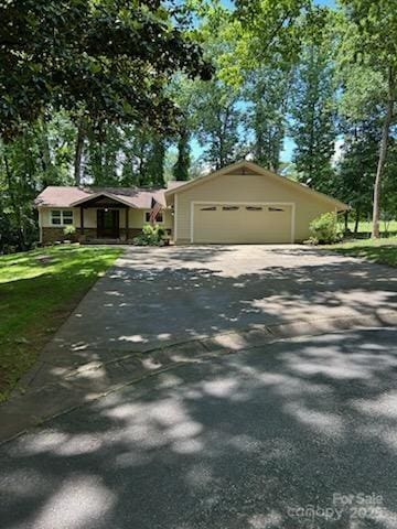 64 Timberidge Dr, Lake Wylie, SC 29710 - view of front of house featuring driveway, a front yard, and a garage