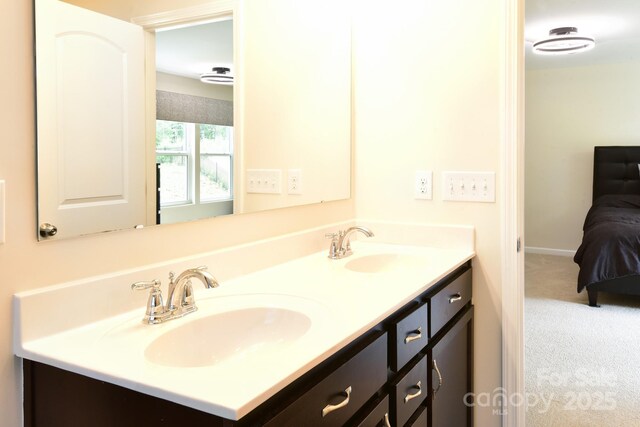 161 Old Harbor Dr, Mount Gilead, NC 27306 - ensuite bathroom featuring double vanity and baseboards