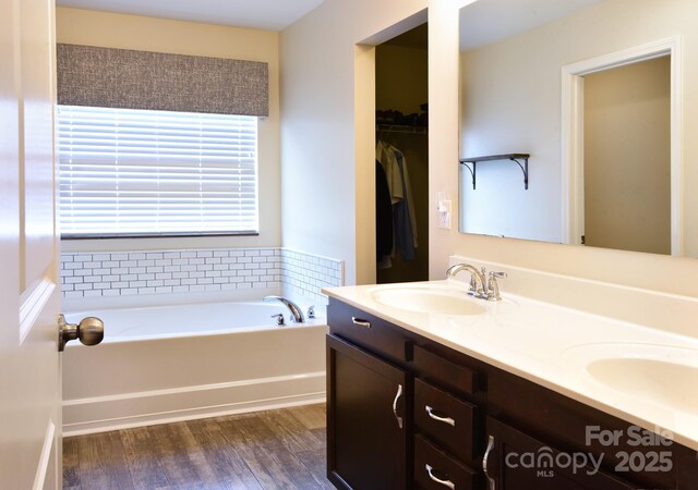 161 Old Harbor Dr, Mount Gilead, NC 27306 - full bath featuring a garden tub, wood finished floors, and double vanity