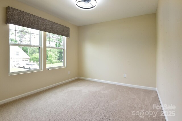 161 Old Harbor Dr, Mount Gilead, NC 27306 - empty room with light carpet and baseboards