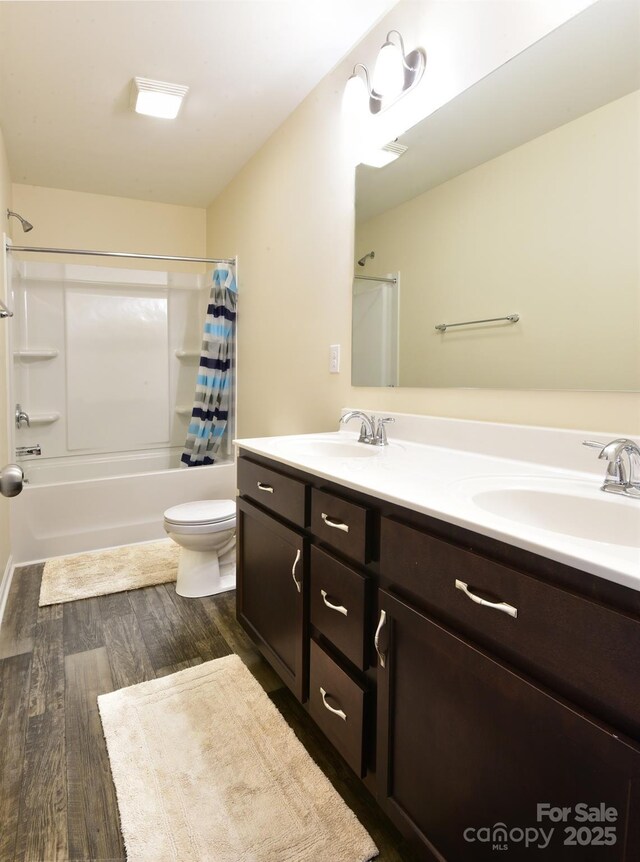 161 Old Harbor Dr, Mount Gilead, NC 27306 - full bath with shower / tub combo, double vanity, toilet, and wood finished floors