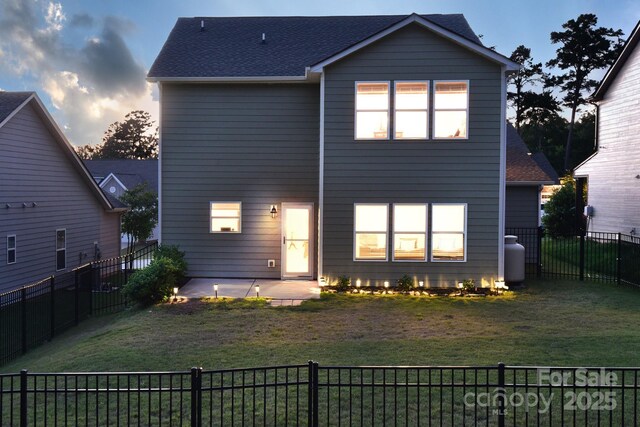 161 Old Harbor Dr, Mount Gilead, NC 27306 - rear view of property featuring a patio and roof with shingles