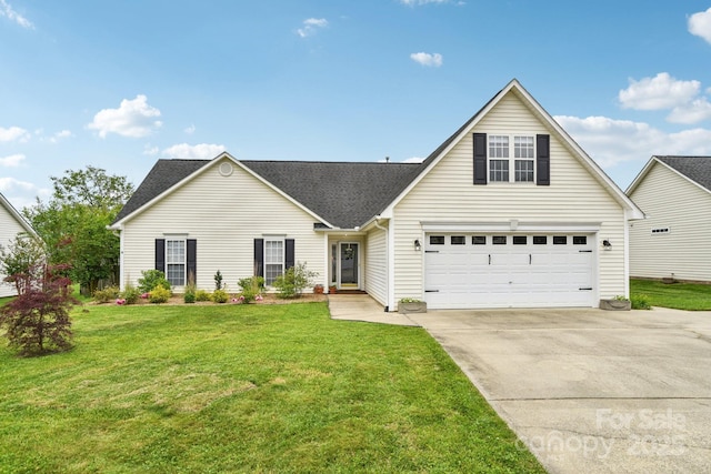 traditional-style house with driveway, a front lawn, and a shingled roof