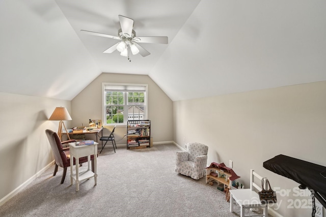 living area featuring carpet, vaulted ceiling, baseboards, and ceiling fan