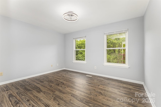 2112 Flint Glenn Ln, Charlotte, NC 28262 - unfurnished room featuring baseboards and dark wood finished floors