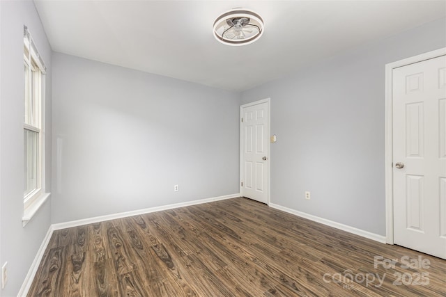 2112 Flint Glenn Ln, Charlotte, NC 28262 - empty room with baseboards and dark wood finished floors