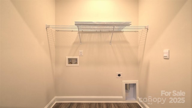 washroom with hookup for a washing machine, electric dryer hookup, wood finished floors, and baseboards