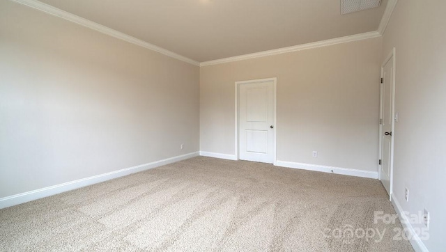 spare room with ornamental molding, carpet floors, and baseboards