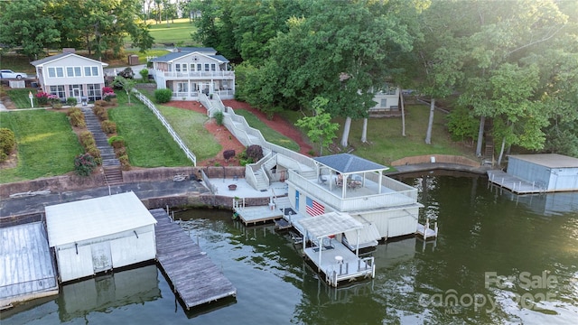 24264 Strand Dr, Albemarle, NC 28001 - dock area featuring stairway, a lawn, and a deck with water view