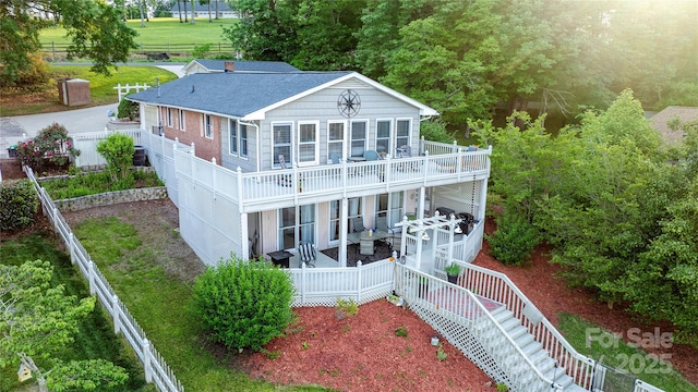24264 Strand Dr, Albemarle, NC 28001 - back of house featuring stairway, a wooden deck, a shingled roof, and fence