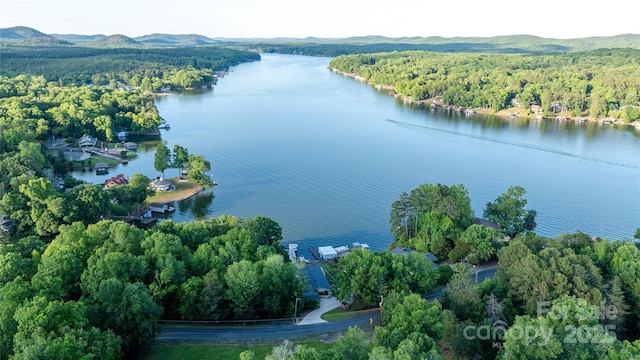24264 Strand Dr, Albemarle, NC 28001 - aerial overview of property's location with a heavily wooded area and a water and mountain view