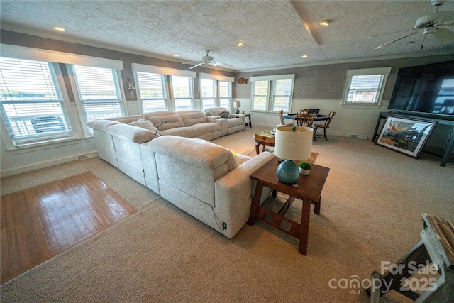 24264 Strand Dr, Albemarle, NC 28001 - living area with ceiling fan, light carpet, a textured ceiling, ornamental molding, and recessed lighting