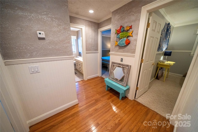 24264 Strand Dr, Albemarle, NC 28001 - hall with crown molding, light wood finished floors, and a wainscoted wall