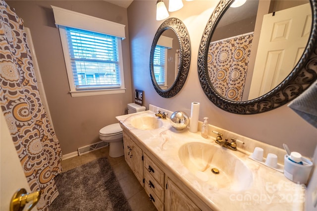 24264 Strand Dr, Albemarle, NC 28001 - bathroom featuring toilet, tile patterned flooring, double vanity, and baseboards