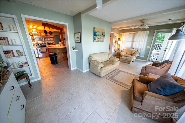 24264 Strand Dr, Albemarle, NC 28001 - living area with a textured ceiling, a ceiling fan, baseboards, light tile patterned flooring, and built in features