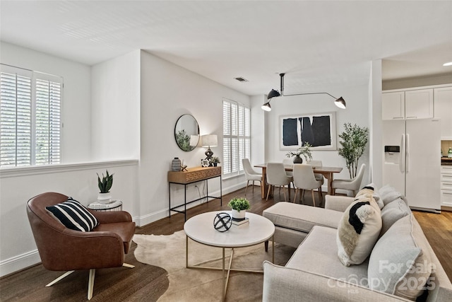 400 N Church St Unit 226, Charlotte, NC 28202 - living room featuring wood finished floors and baseboards