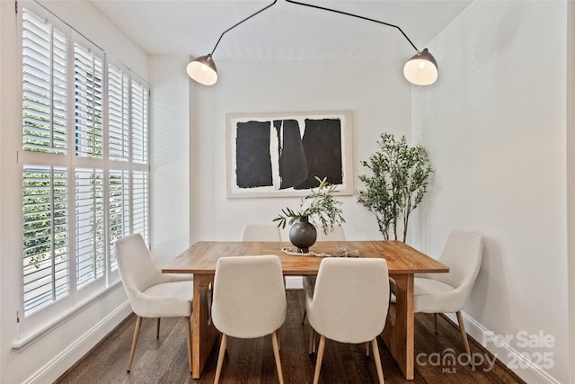 400 N Church St Unit 226, Charlotte, NC 28202 - dining space featuring baseboards, wood finished floors, and healthy amount of natural light