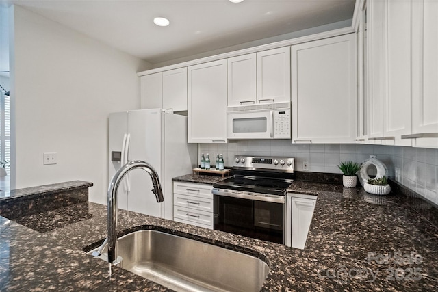 400 N Church St Unit 226, Charlotte, NC 28202 - kitchen with white appliances, a sink, tasteful backsplash, white cabinets, and recessed lighting