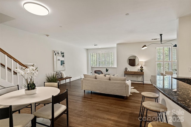 400 N Church St Unit 226, Charlotte, NC 28202 - living room featuring healthy amount of natural light, dark wood-style floors, and stairs