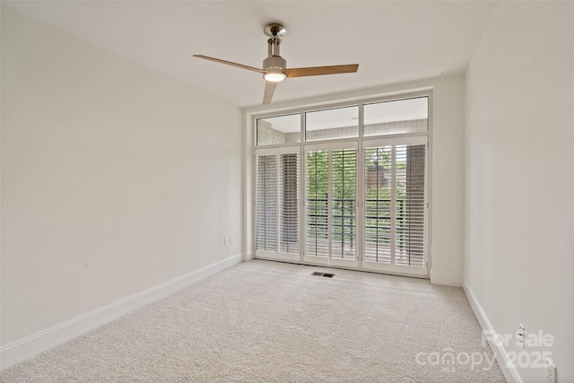 400 N Church St Unit 226, Charlotte, NC 28202 - empty room with carpet, ceiling fan, and baseboards