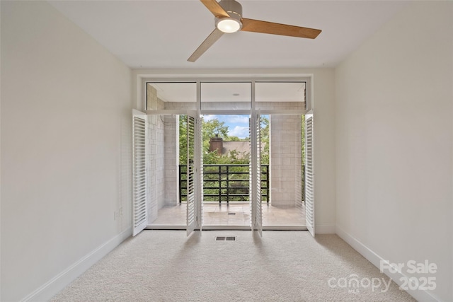 400 N Church St Unit 226, Charlotte, NC 28202 - unfurnished room featuring carpet flooring, baseboards, and a ceiling fan