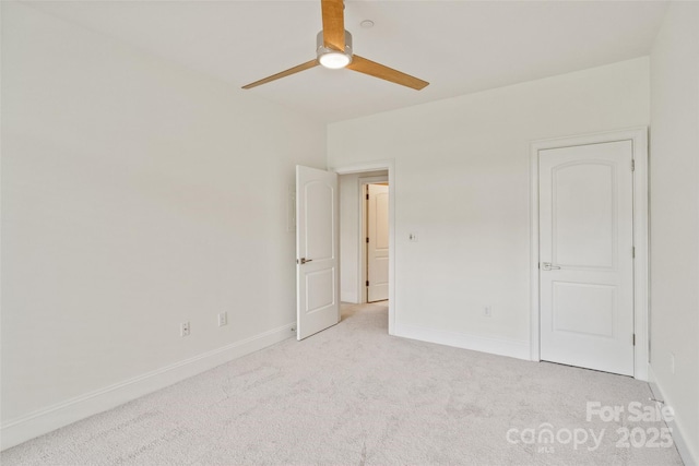 400 N Church St Unit 226, Charlotte, NC 28202 - unfurnished bedroom with light carpet, baseboards, and a ceiling fan