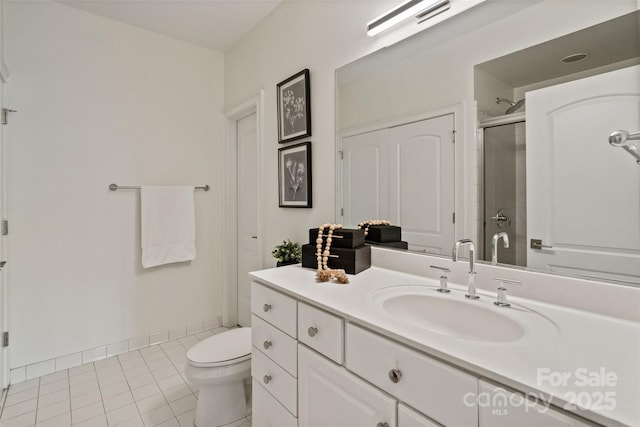 400 N Church St Unit 226, Charlotte, NC 28202 - bathroom with toilet, vanity, a shower with shower door, and tile patterned floors