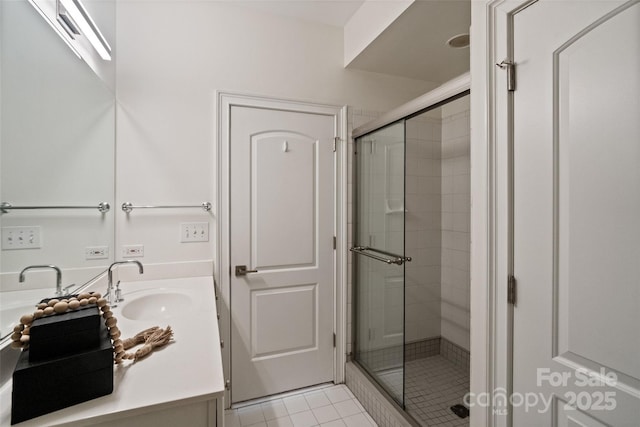 400 N Church St Unit 226, Charlotte, NC 28202 - bathroom featuring vanity, a shower stall, and tile patterned flooring